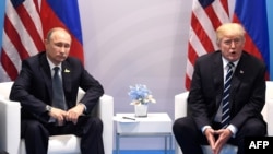 Уладзімер Пуцін і Дональд Трамп падчас саміту G20, Гамбург, 7 ліпеня 2017